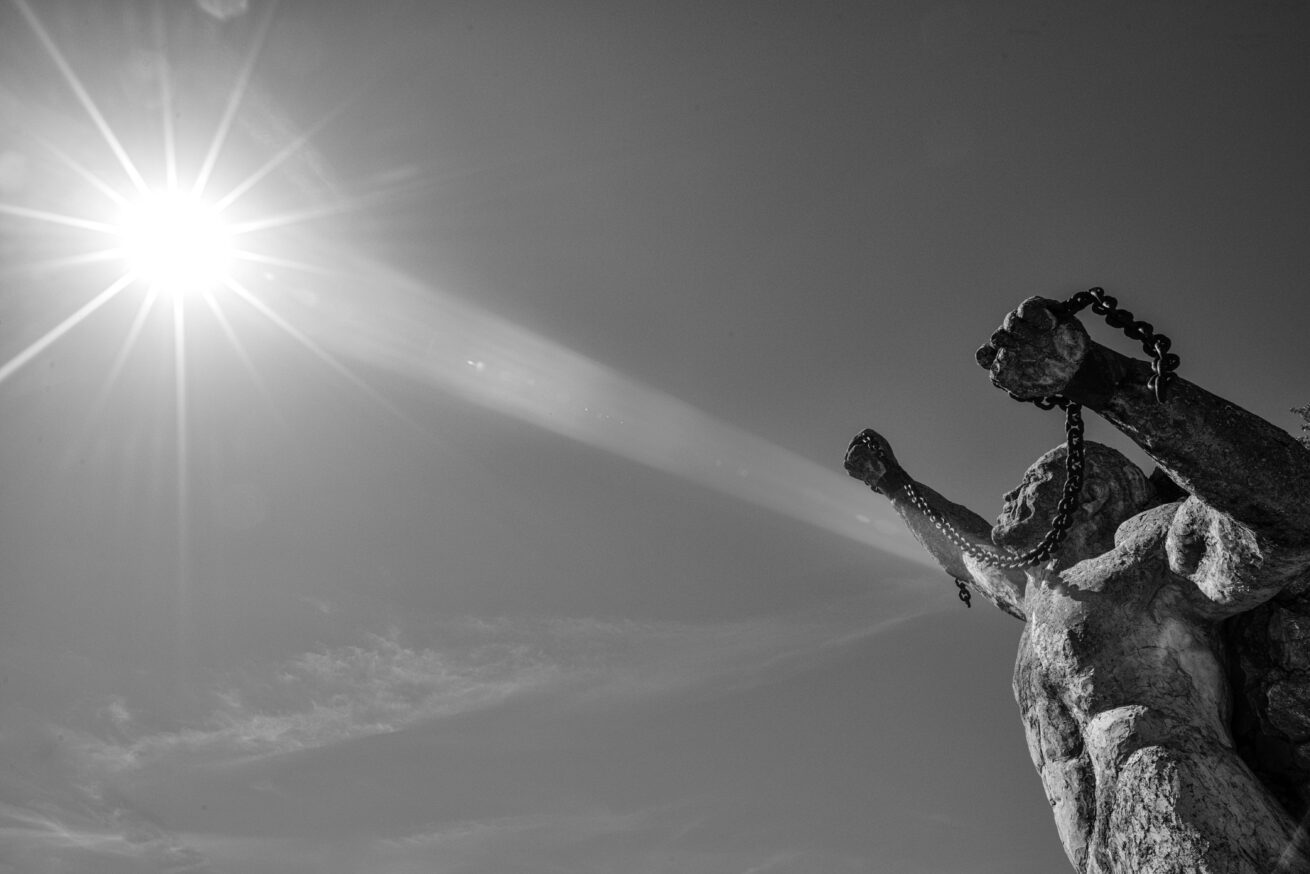 black and white photo ken fox statues man in chains auburn california chris allan sunburst public art