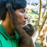 Holding Squirrel monkey Peru-6653