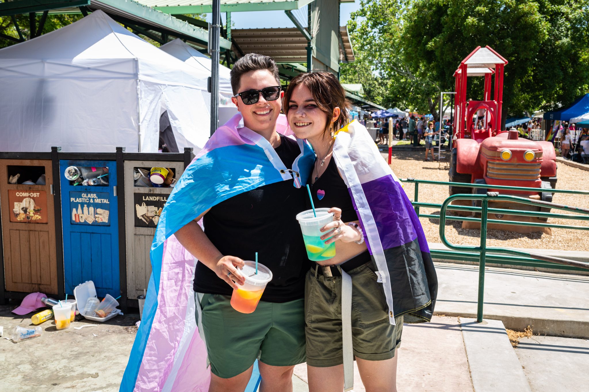 micara and daniel, queer couple, bisexual flag, cape, davis pride, davis, california, pride month, gay community, event, chris allan, freelance photojournalist, news photography, lgbtq, event, colorful