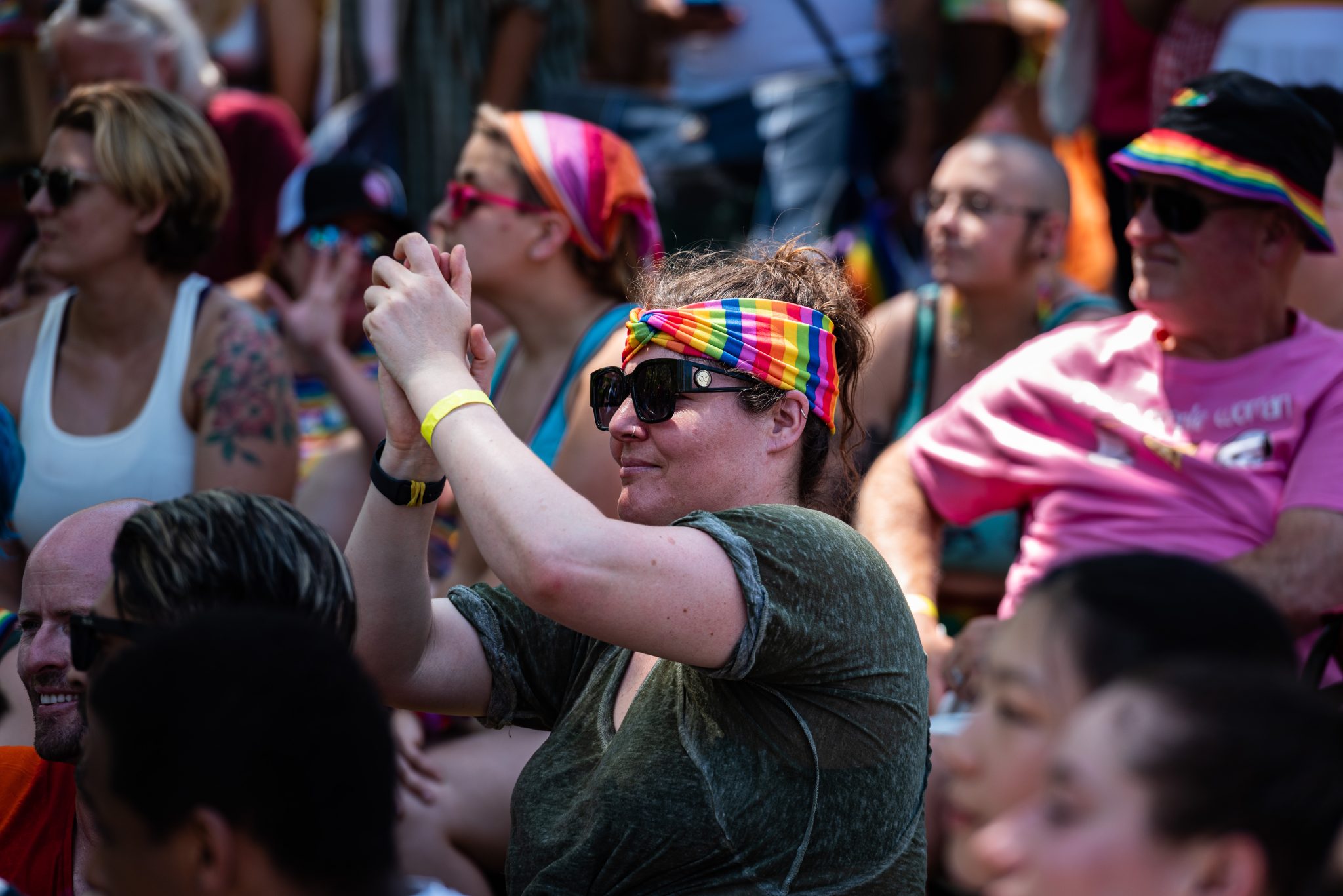 rainbow headband, fan, clapping, davis pride, davis, california, pride month, gay community, event, chris allan, freelance photojournalist, news photography, lgbtq, event, colorful