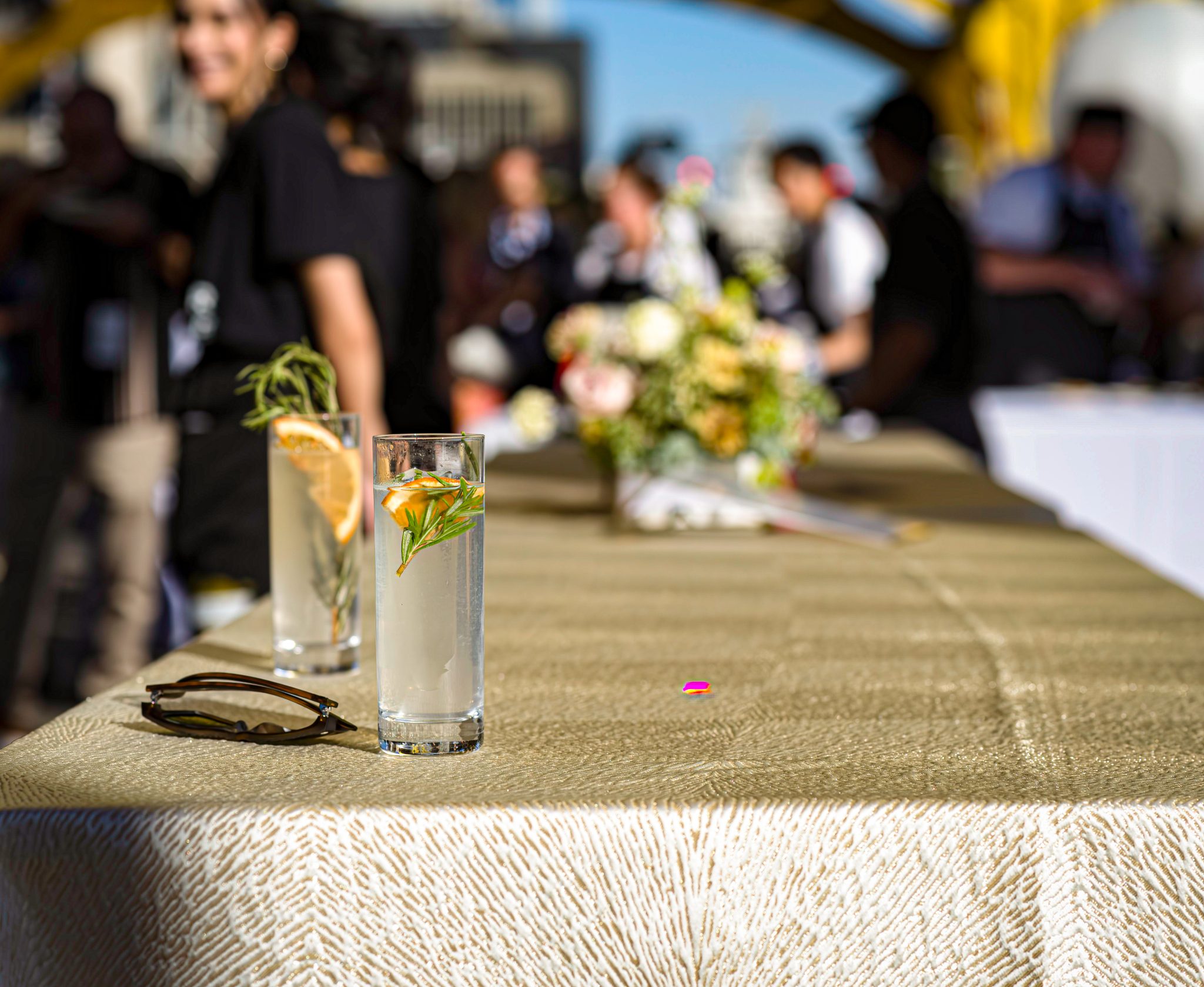 cocktails on table, long table, orange slice, garnish, people, Tower Bridge dinner, farm to fork festival, sacramento, california, bridge dinner, event, gourmet food