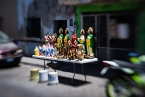 Catholic, figurines, for sale, street vendor, table, selective focus, lensbaby, tlaquepaque, Guadalajara, mexico, photojournalism, travel, tourism, jalisco, chris allan, imagesbychrisa.com, photography, documentary