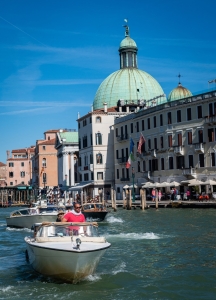 venice photography, venice photos, travel photos, lesbian photographer, gay photographer, Man in red, boat, grand canal, Venice, Italy