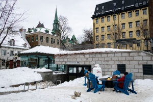 Quebec city, quebec, chris allan, travel photography, freelance, outdoor firepit, yellow building, blue adirondack chairs, people, snow