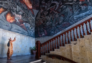 governors palace, woman, taking photos, orozco murals, art, stairway, interior, Guadalajara, mexico, photojournalism, travel, tourism, jalisco, chris allan, imagesbychrisa.com, photography, documentary