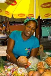 woman, working, market, blue, smiling, food, coconut, Saint Lucia, caribbean, island, vacation, holiday, honeymoon, lesser antilles, english speaking, beautiful, volcanic island, travel blog, travel, tourism, travel photography, castries